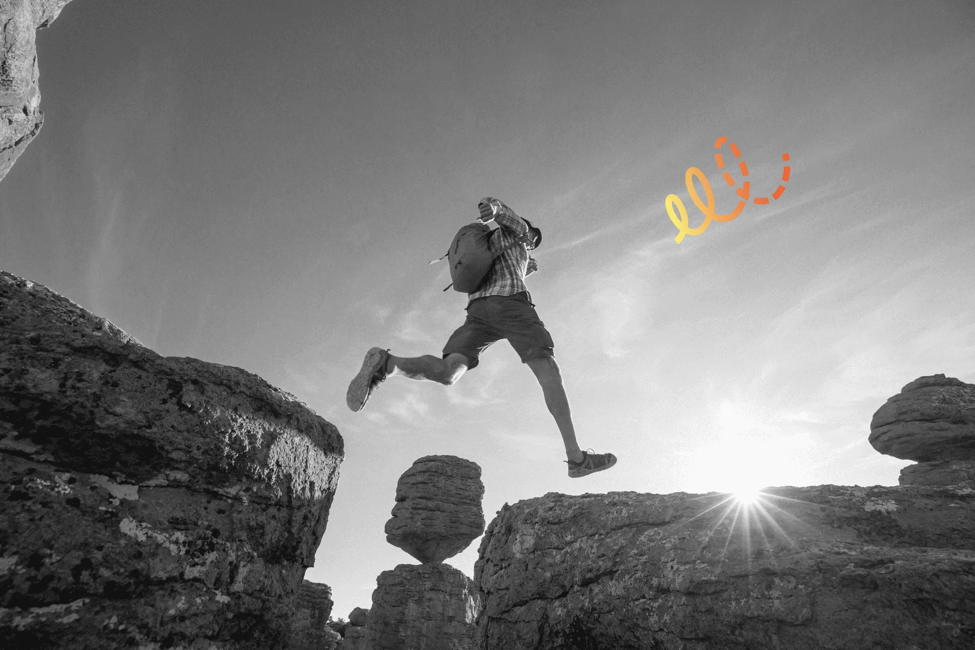 Un homme saute entre les falaises dans les montagnes avec motif graphique